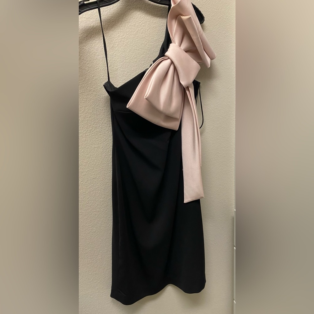 Black dress with pink bow